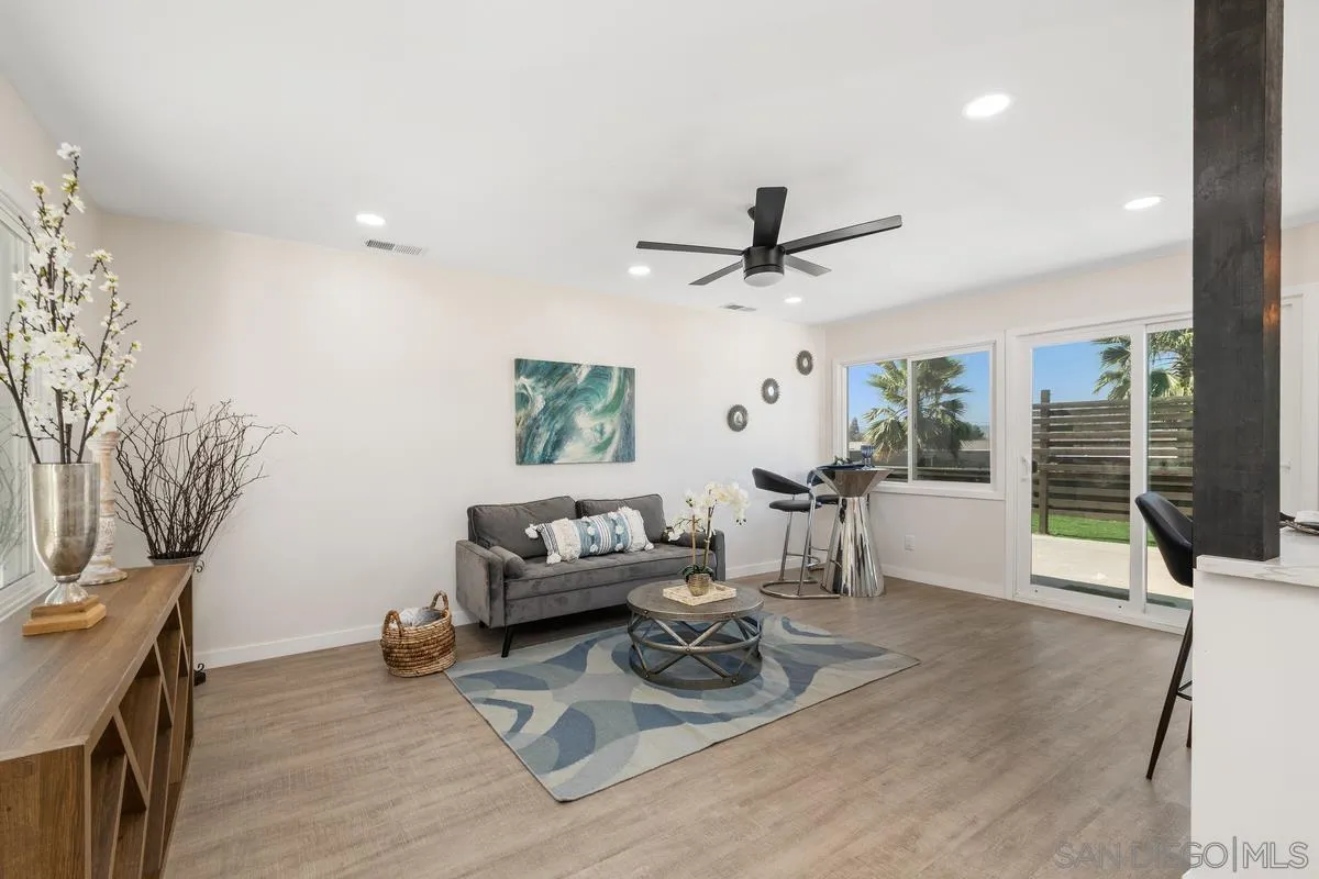 9257 Ruffin Road Santee, CA 92071 - Photo 5 of 28 a living room with furniture and a large window