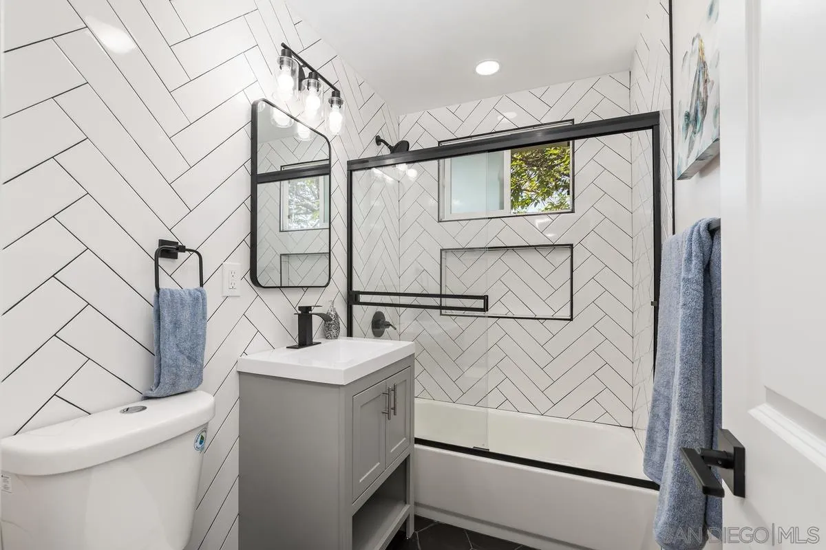 9257 Ruffin Road Santee, CA 92071 - Photo 7 of 28 a bathroom with a sink a toilet and shower