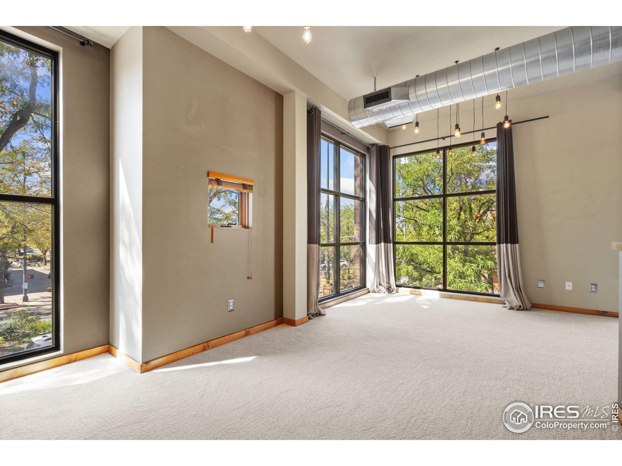 200 South College Avenue, Unit 201 Fort Collins, CO 80524 - Photo 13 of 19 a view of an empty room with a window