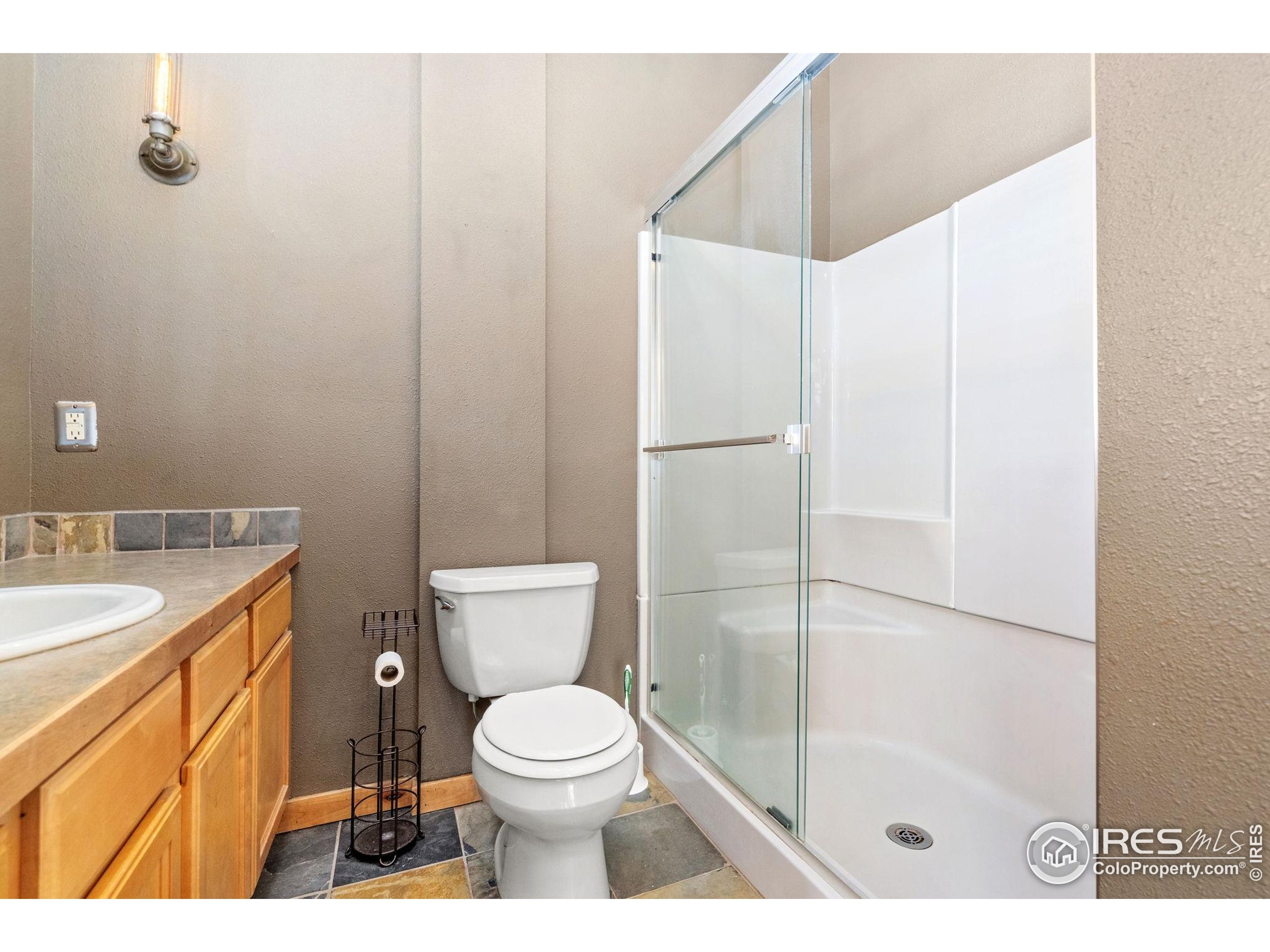 200 South College Avenue, Unit 201 Fort Collins, CO 80524 - Photo 15 of 19 a bathroom with a sink a toilet and shower