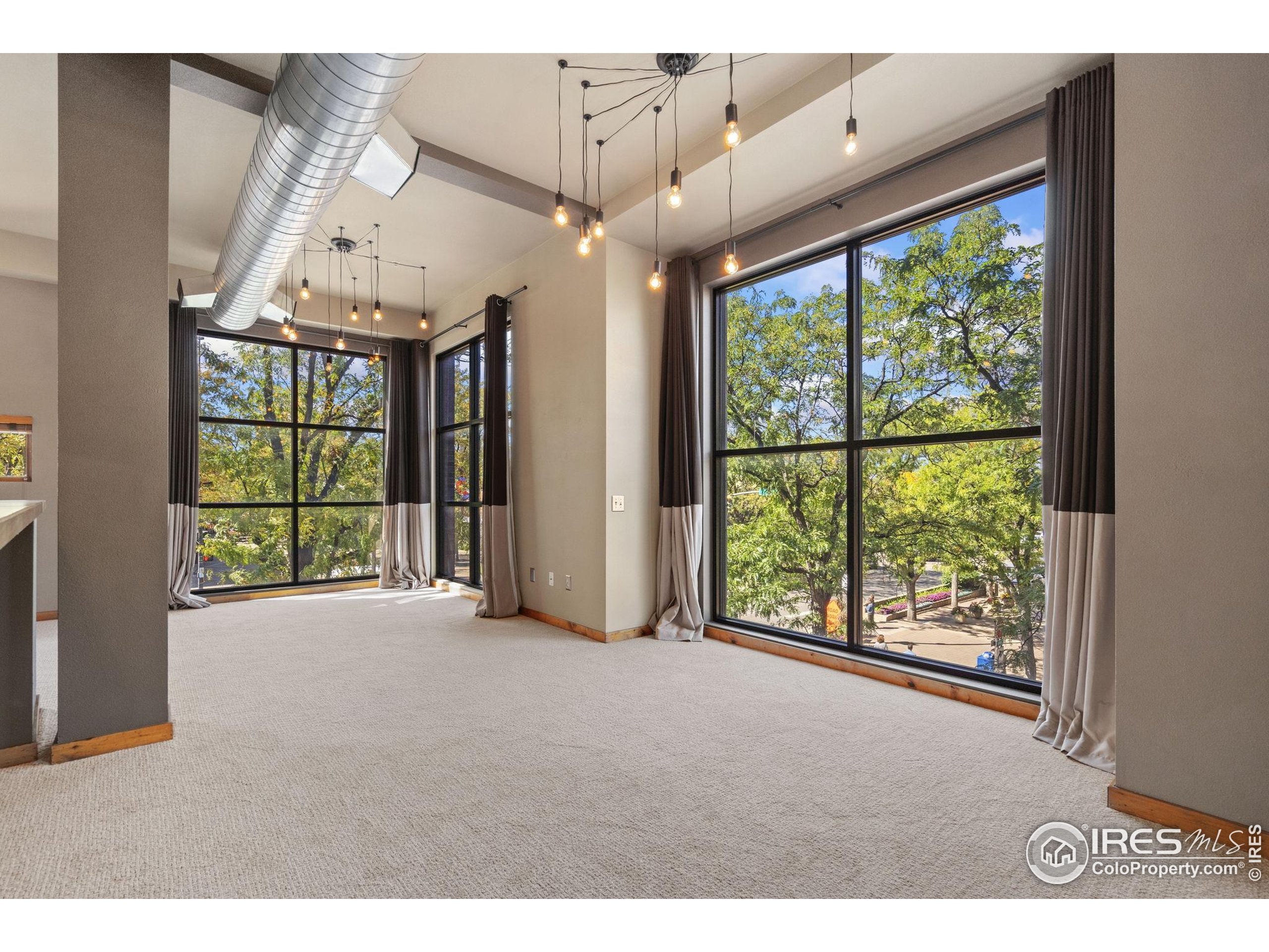 200 South College Avenue, Unit 201 Fort Collins, CO 80524 - Photo 6 of 19 a view of an entryway with a floor to ceiling window