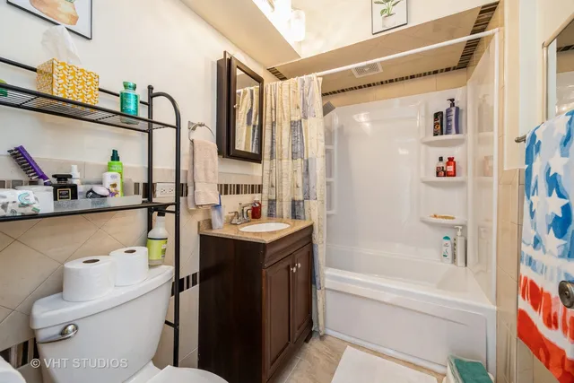 a view of a kitchen with a sink and a fireplace