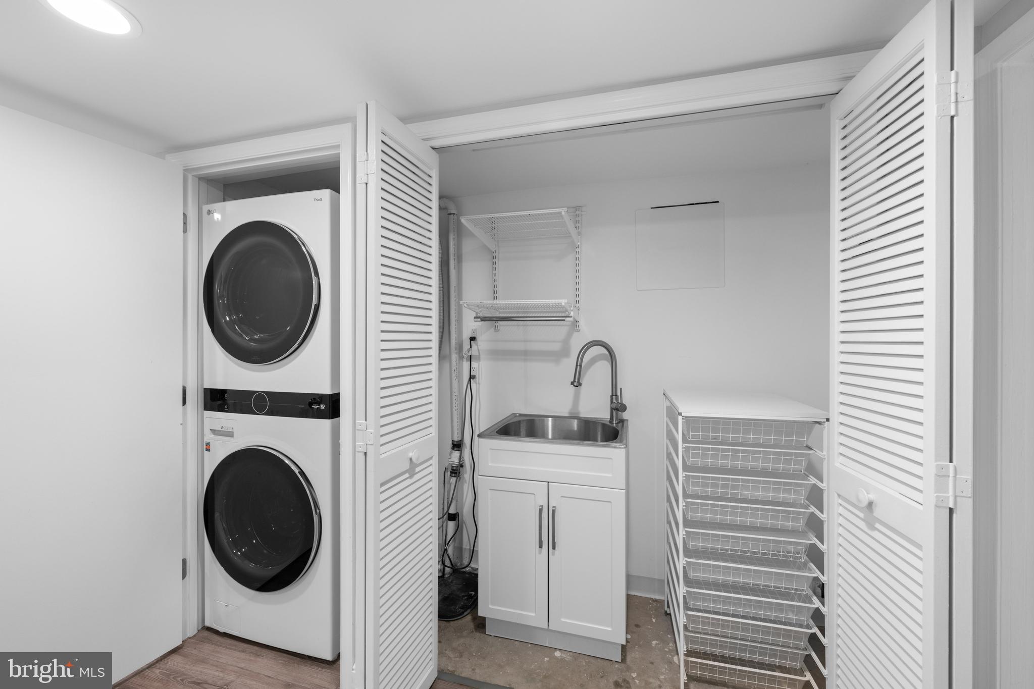 3915 47th Street Northwest Washington, DC 20016 - Photo 30 of 40 a utility room with sink dryer and washer
