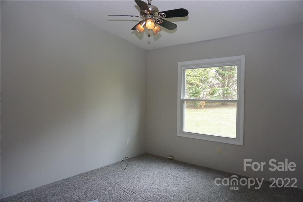 1291 Hines Road Clover, SC 29710 - Photo 16 of 26 an empty room with a window and a fan