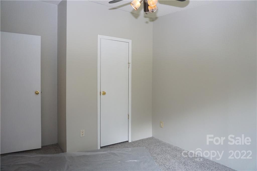 1291 Hines Road Clover, SC 29710 - Photo 17 of 26 an empty room with a chandelier fan