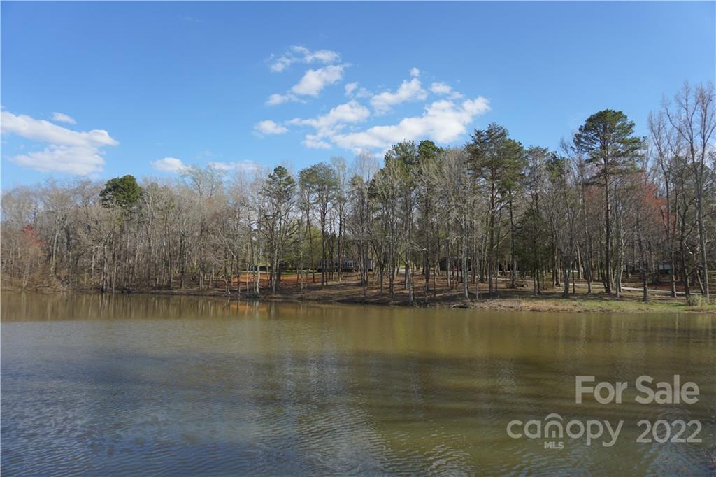 1291 Hines Road Clover, SC 29710 - Photo 2 of 26 a view of a lake with houses in the back