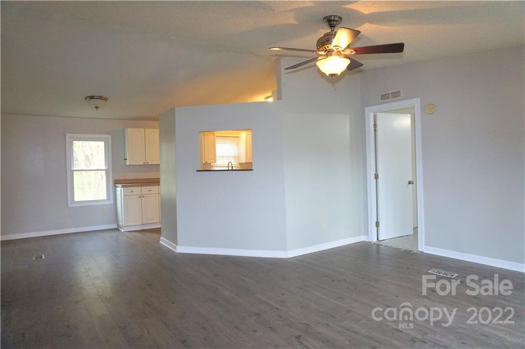 1291 Hines Road Clover, SC 29710 - Photo 8 of 26 a view of an empty room with window and wooden floor