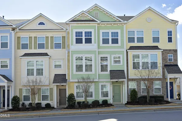 a front view of a building with a yard