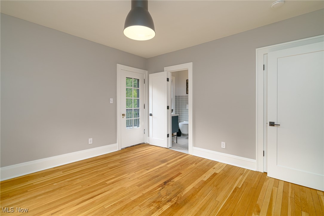 2624 Lee Road Cleveland, OH 44118 - Photo 27 of 50 Bedroom #2 with light hardwood flooring access to Jack and Jill full bathroom, new doors and hardware, modern light fixture
