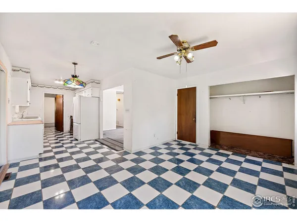 a living room with a black white checkered floor with a black white checkered floor