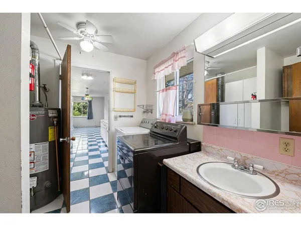 a bathroom with a sink double vanity and a mirror