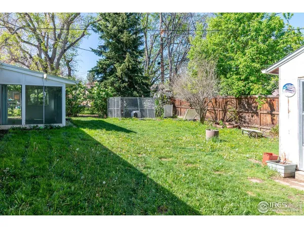 a view of a backyard with a small cabin