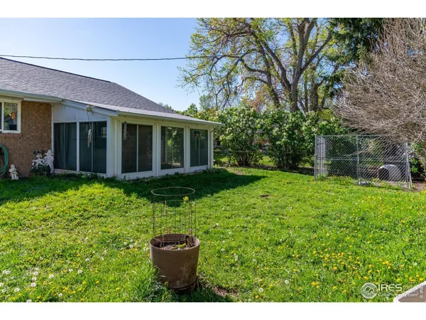 a view of an house with backyard space and garden