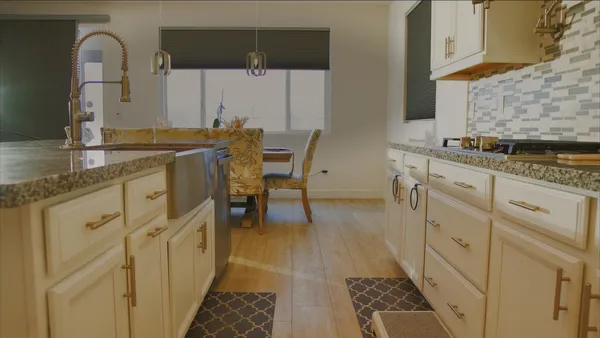 a spacious bathroom with a granite countertop sink a mirror and a shower