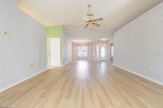 a view of an empty room and wooden floor