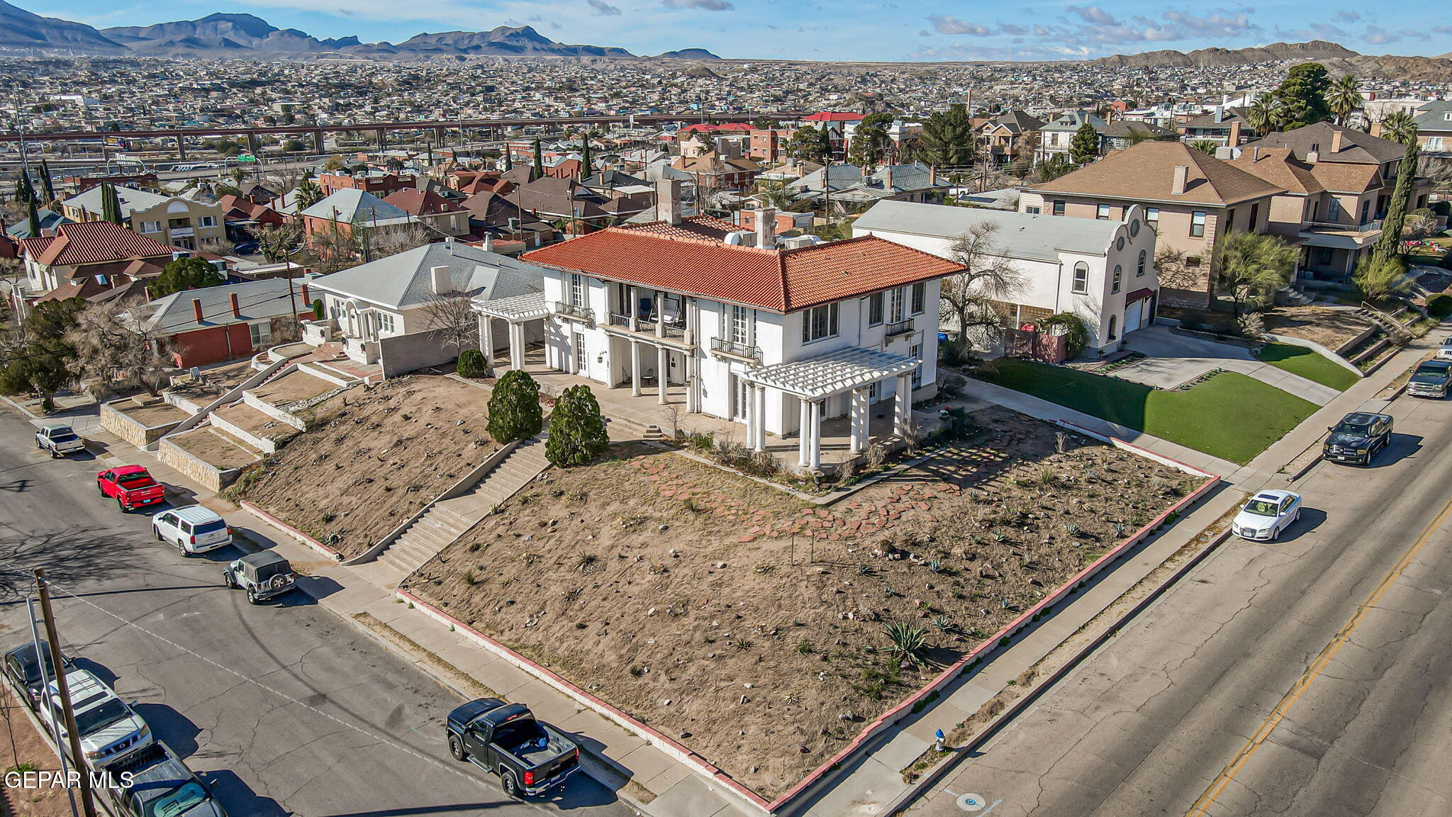 525 Corto Way El Paso, TX 79902 - Photo 2 of 98 an aerial view of a residential apartment building with a mountain