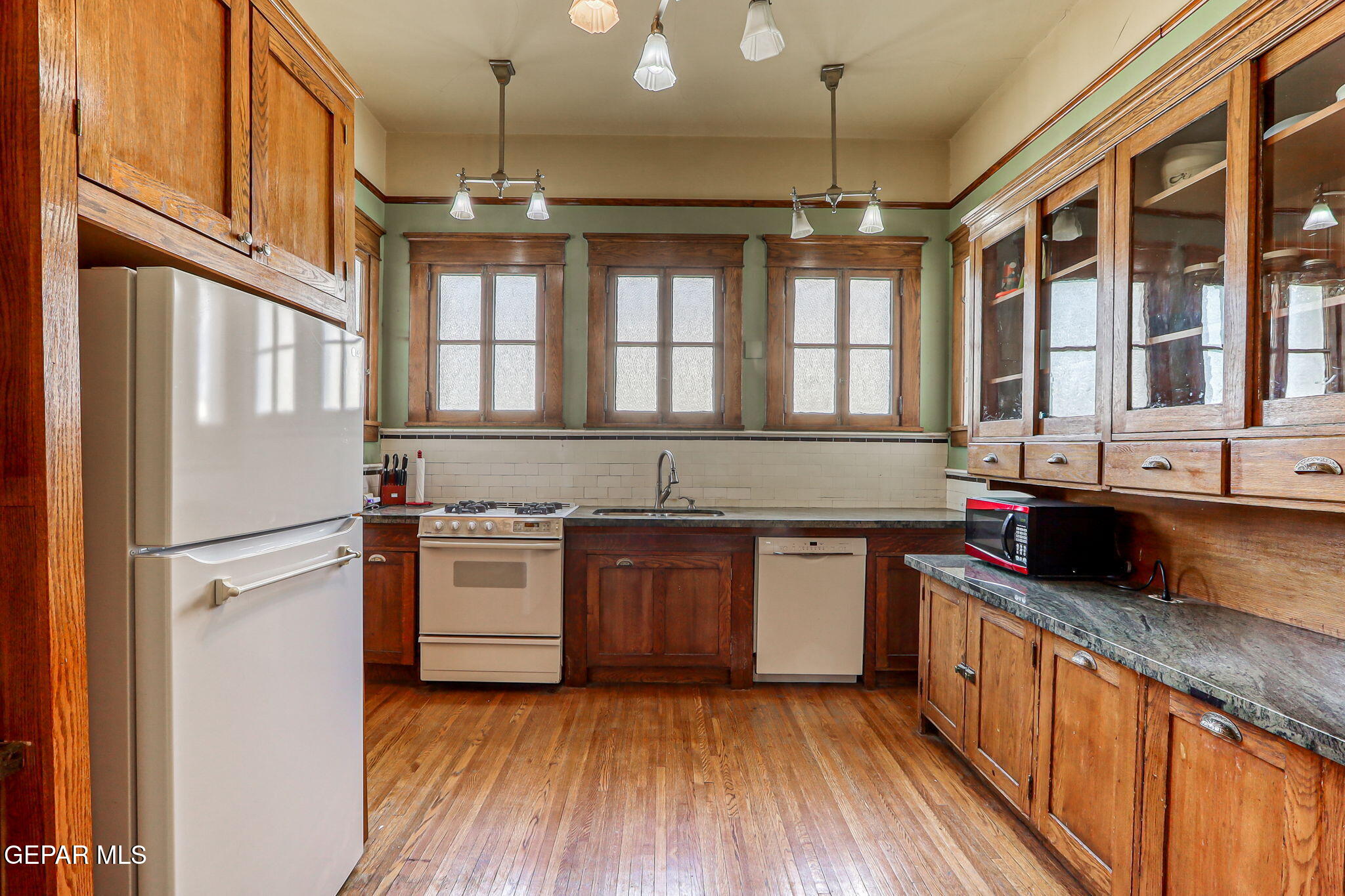 525 Corto Way El Paso, TX 79902 - Photo 24 of 98 a kitchen with stainless steel appliances granite countertop a sink and stove