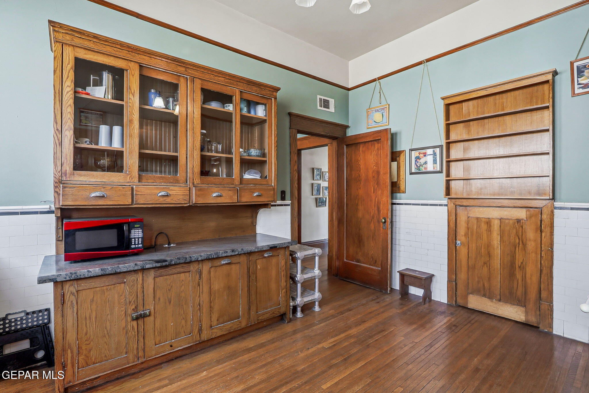 525 Corto Way El Paso, TX 79902 - Photo 28 of 98 a kitchen with stainless steel appliances granite countertop a refrigerator and wooden cabinets