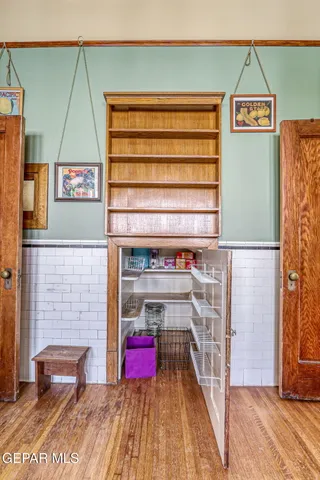 a living room with furniture a rug and a chandelier