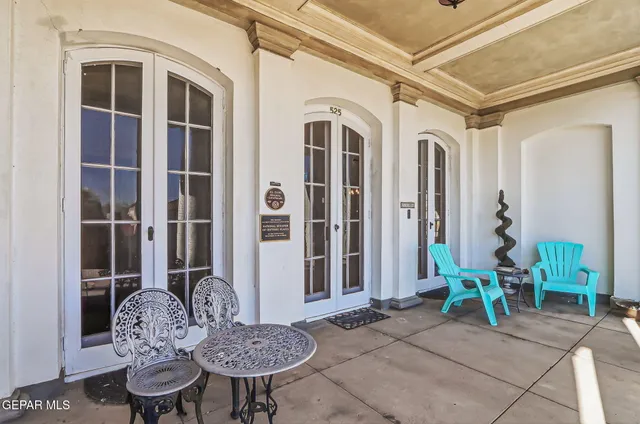 a view of a livingroom with furniture and stairs