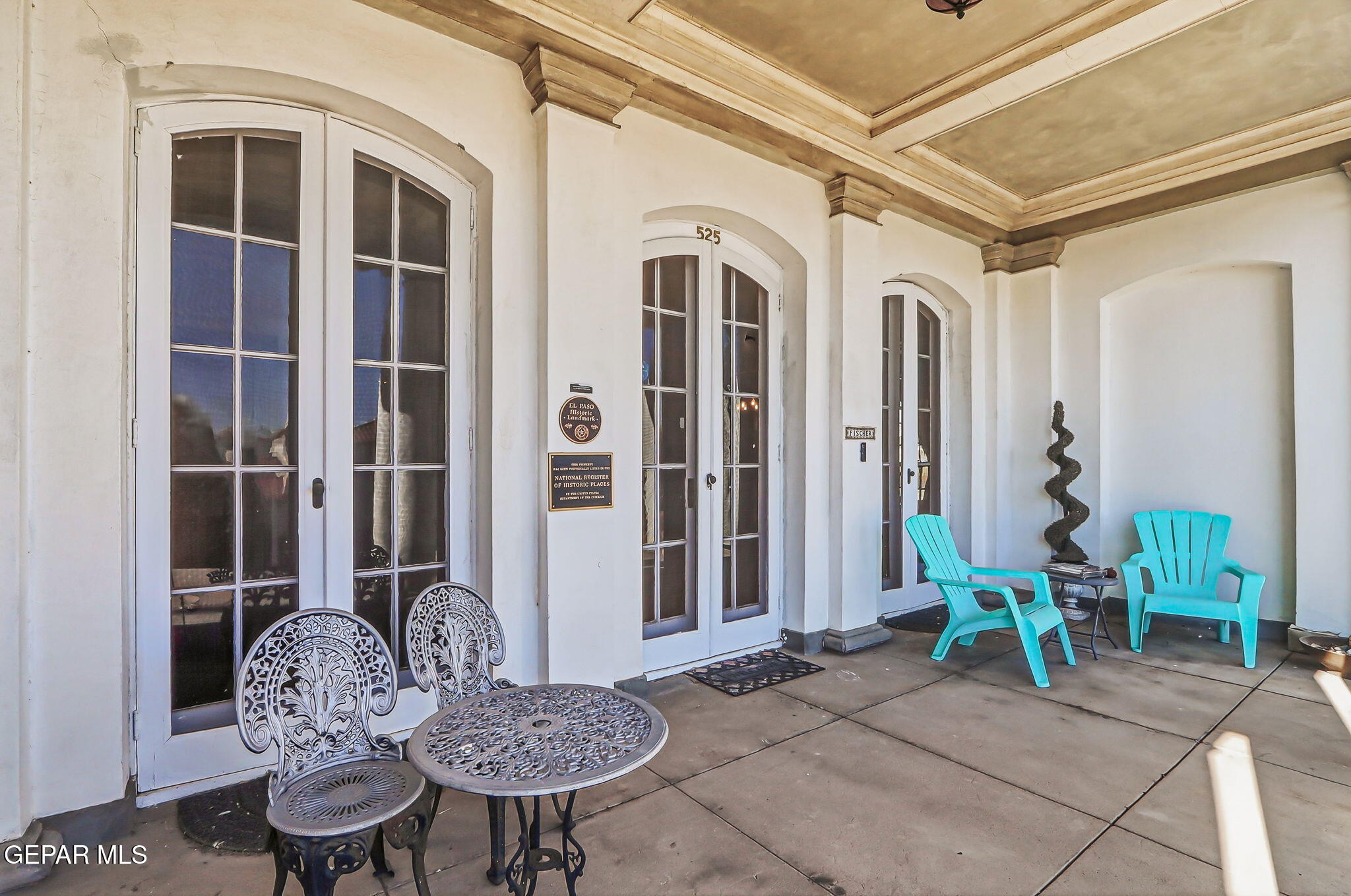 525 Corto Way El Paso, TX 79902 - Photo 3 of 98 a view of a patio with table and chairs and potted plants