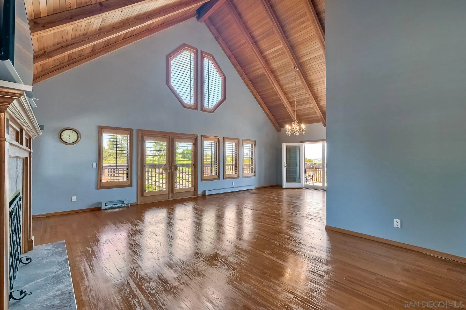 2511 Vía Rancheros Fallbrook, CA 92028 - Photo 18 of 59 a view of an empty room with wooden floor and a window