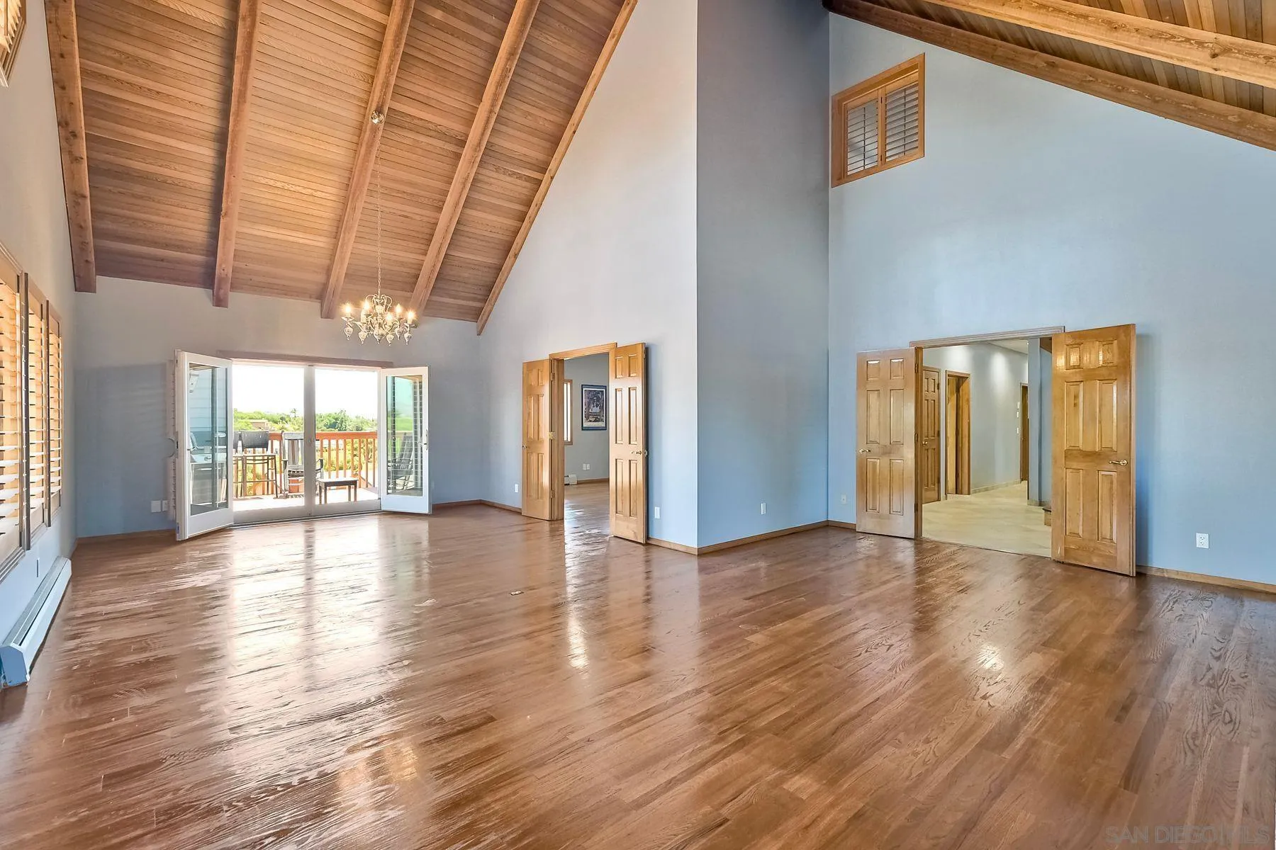 2511 Vía Rancheros Fallbrook, CA 92028 - Photo 19 of 59 a view of an empty room with wooden floor and a window