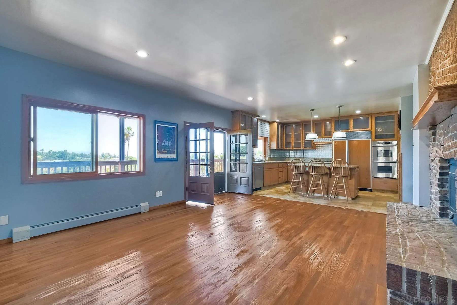 2511 Vía Rancheros Fallbrook, CA 92028 - Photo 22 of 59 a view of an empty room with window and wooden floor