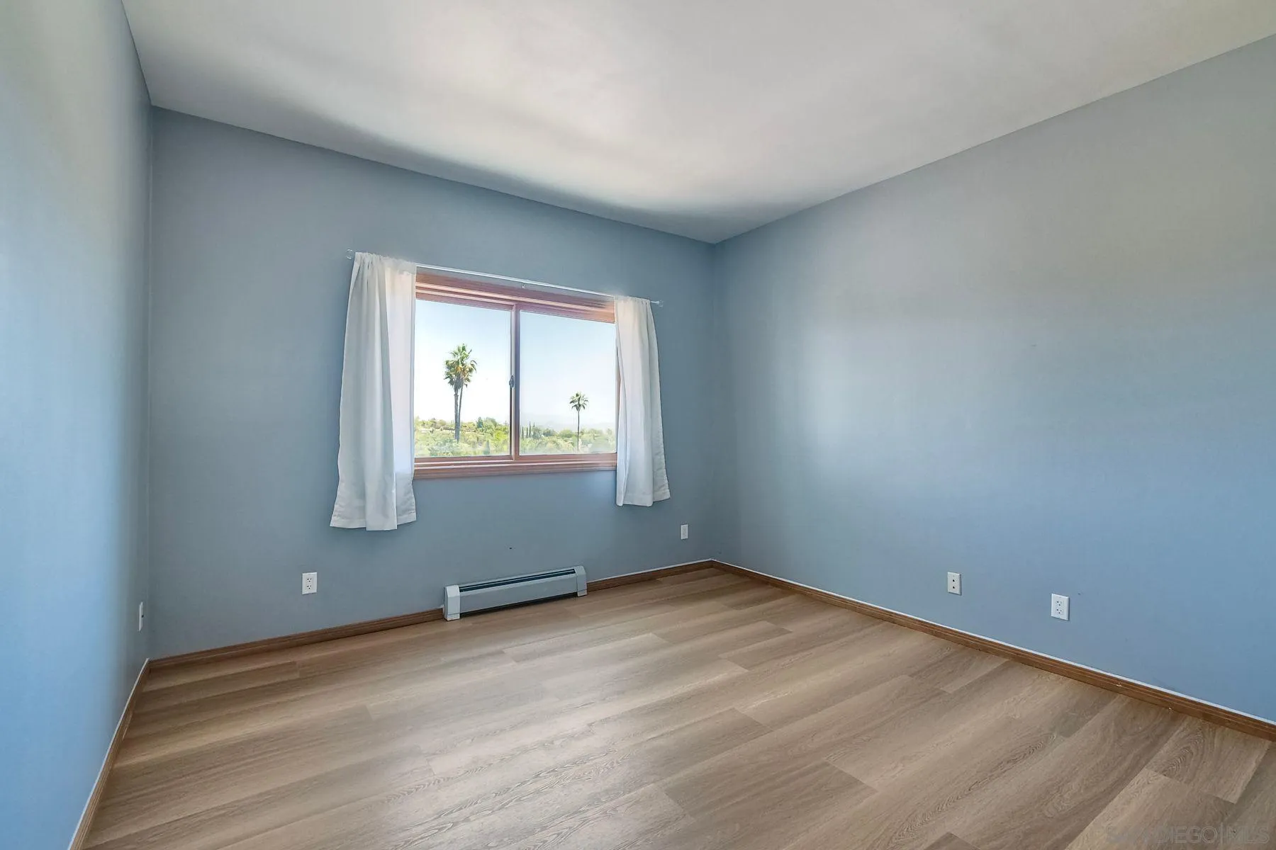 2511 Vía Rancheros Fallbrook, CA 92028 - Photo 27 of 59 wooden floor and window in an empty room