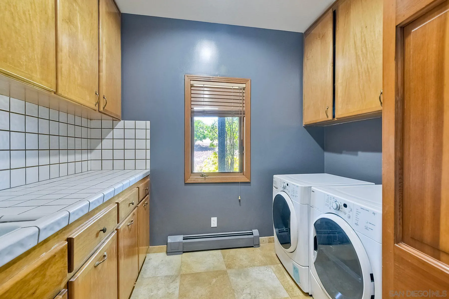 2511 Vía Rancheros Fallbrook, CA 92028 - Photo 29 of 59 a utility room with dryer and washer