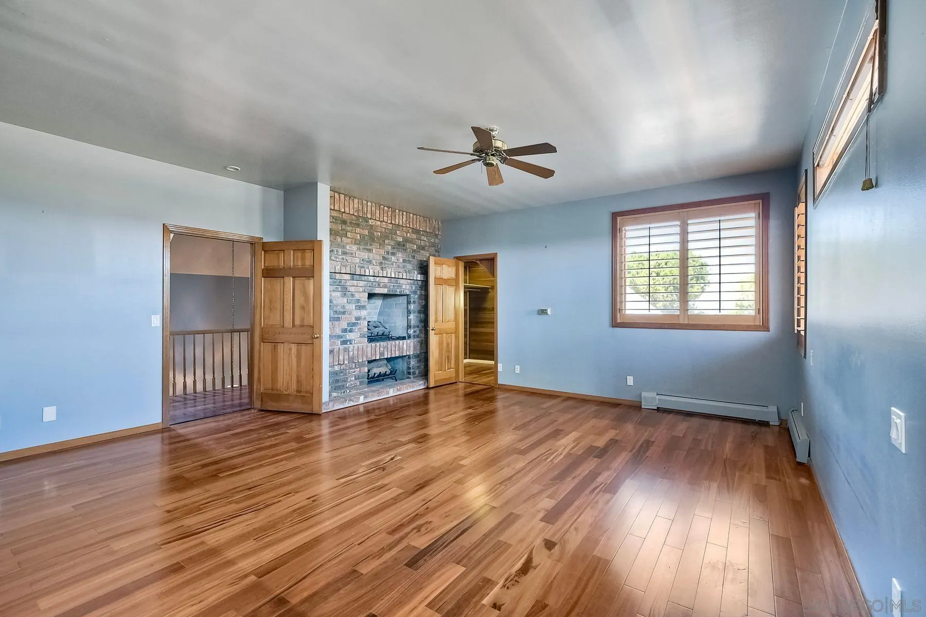 2511 Vía Rancheros Fallbrook, CA 92028 - Photo 33 of 59 an empty room with wooden floor closet and windows