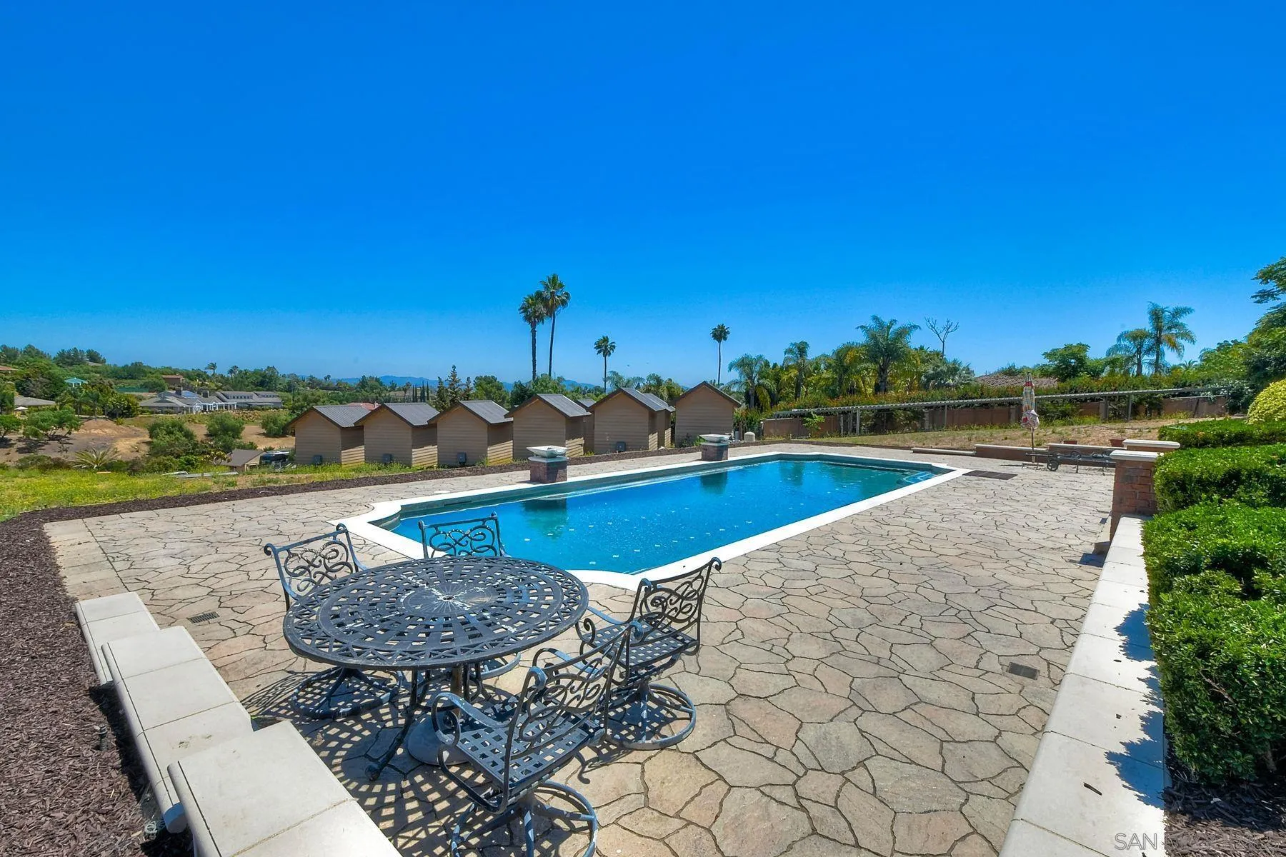 2511 Vía Rancheros Fallbrook, CA 92028 - Photo 50 of 59 a view of a swimming pool with lounge chairs