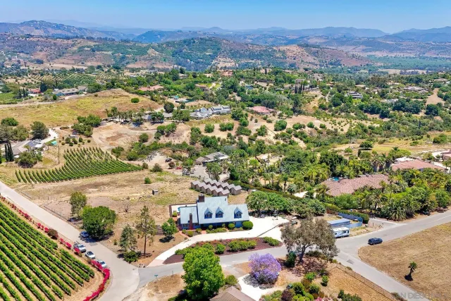 an aerial view of residential houses and outdoor space