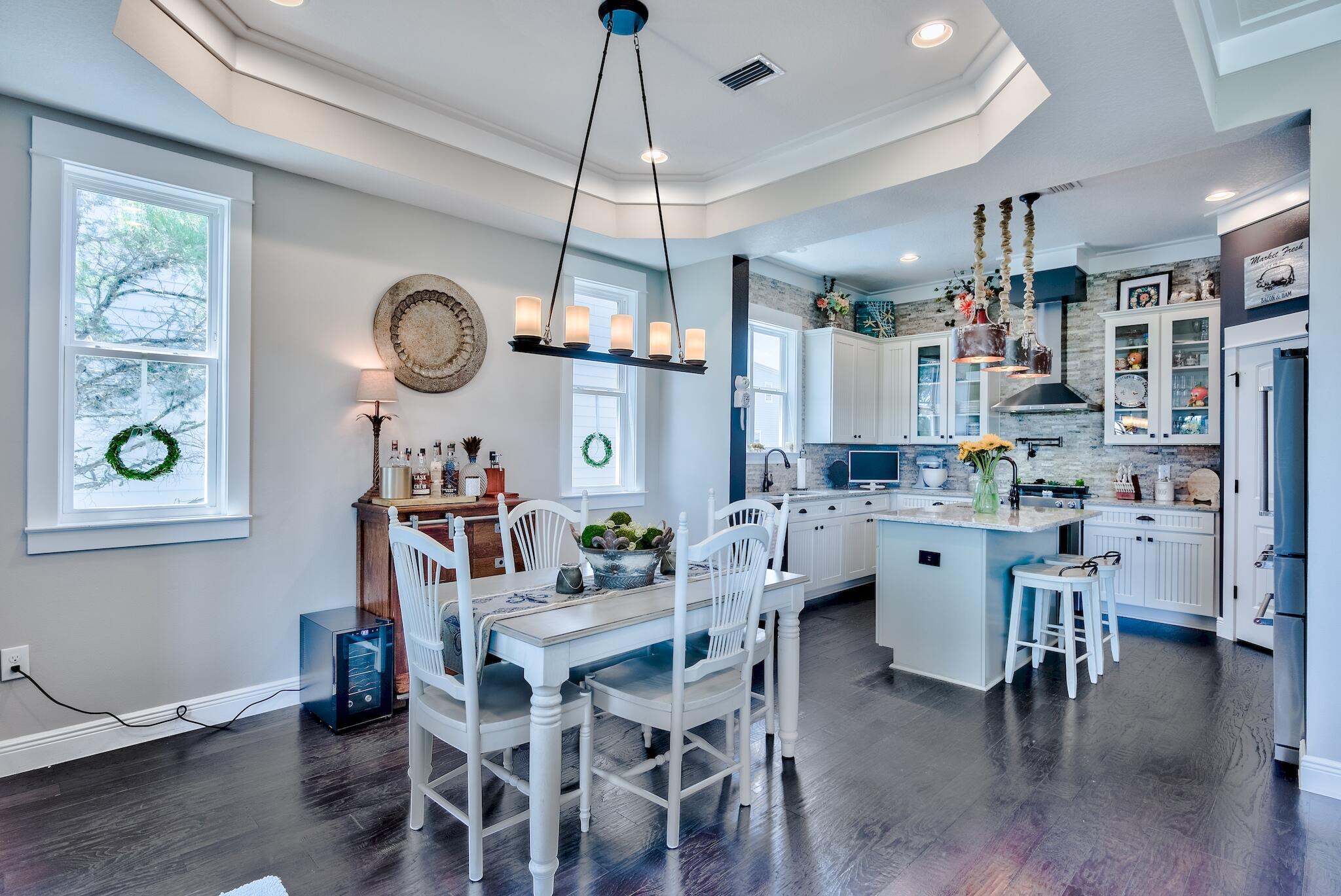 5 Inlet Cove Inlet Beach, FL 32461 - Photo 11 of 52 a dining room with a wooden table and chairs