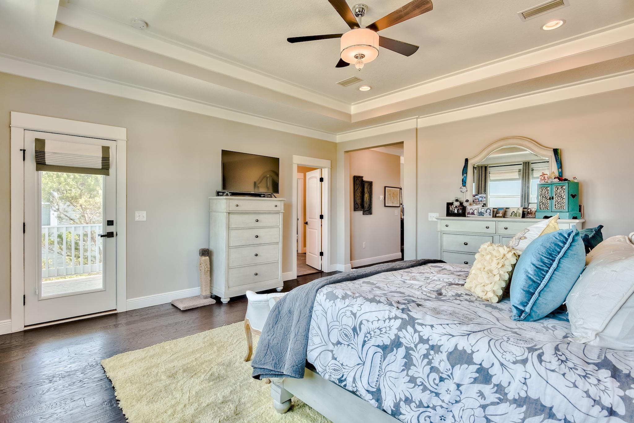 5 Inlet Cove Inlet Beach, FL 32461 - Photo 26 of 52 a bedroom with a large bed and wooden floor