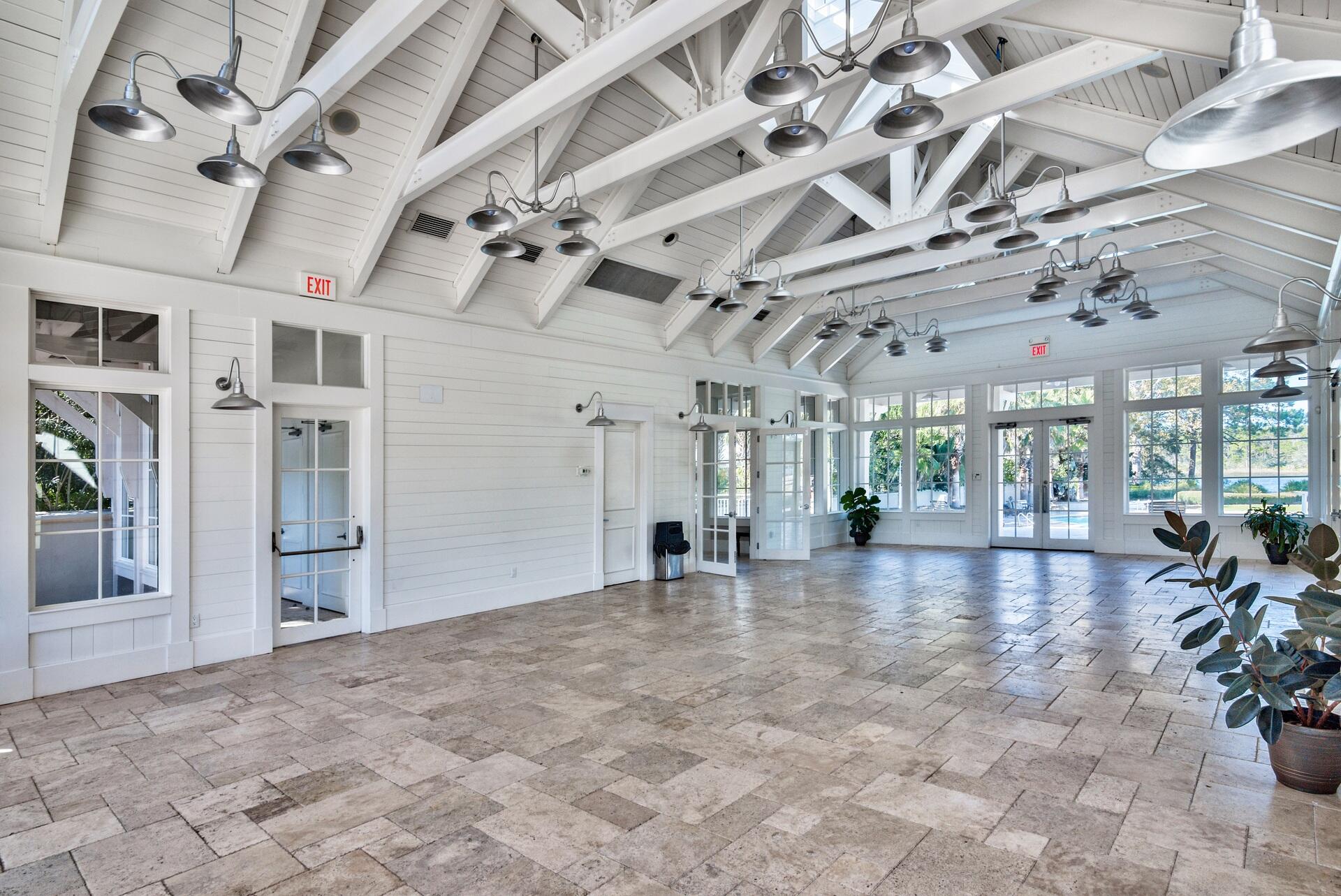 5 Inlet Cove Inlet Beach, FL 32461 - Photo 48 of 52 a view of a hall with a dining table chairs and a chandelier