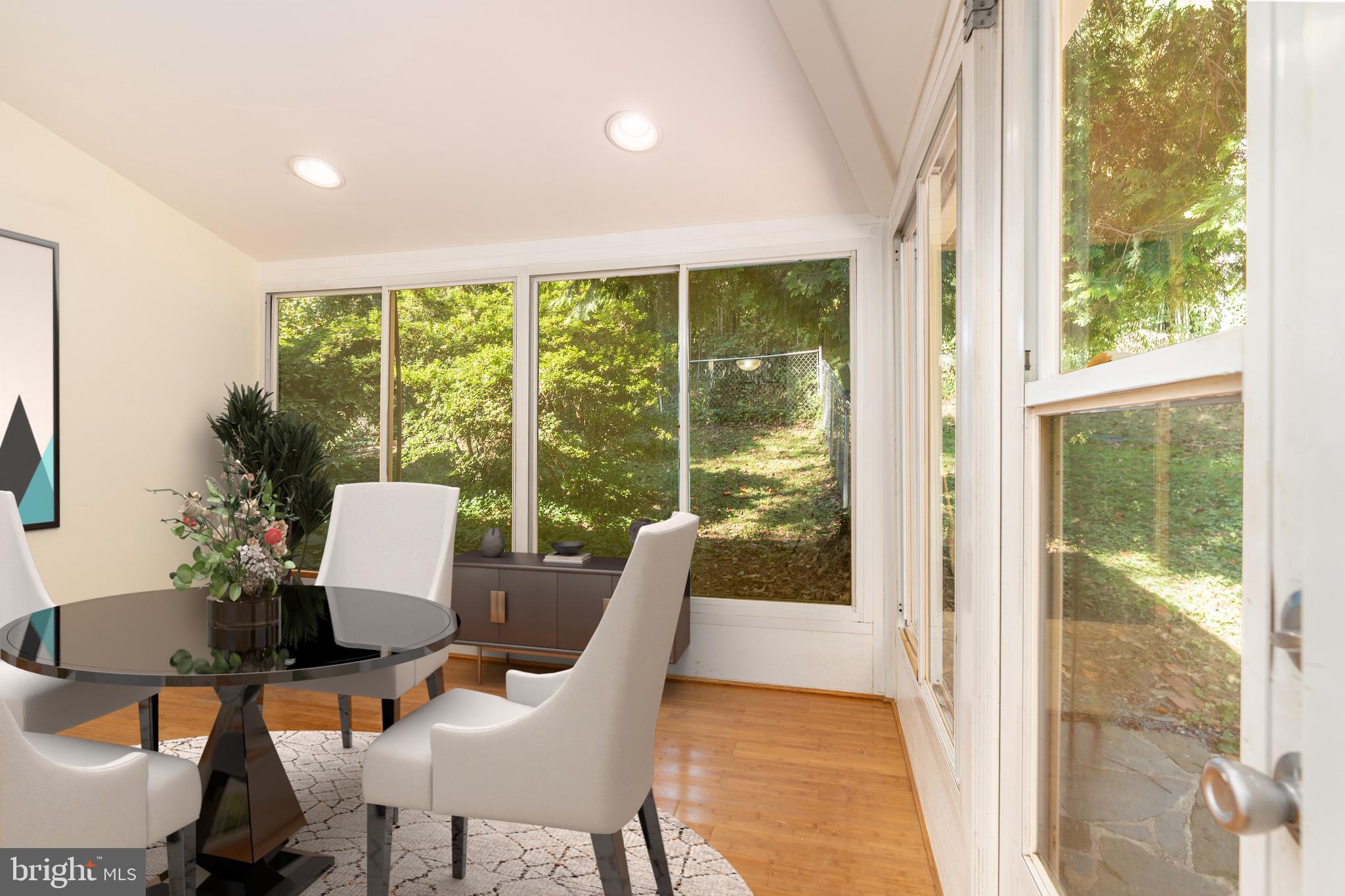 6221 Walhonding Road Bethesda, MD 20816 - Photo 16 of 51 a view of a dining room with furniture window and outside view