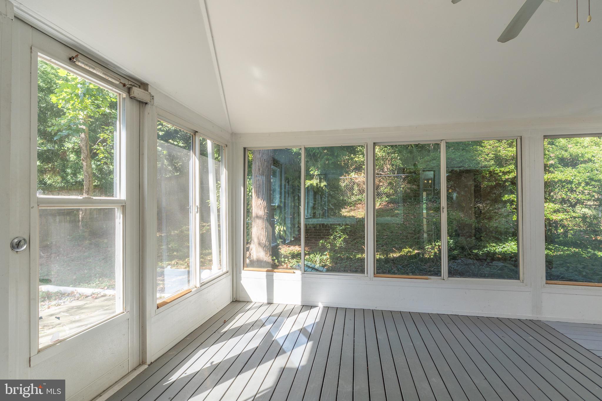 6221 Walhonding Road Bethesda, MD 20816 - Photo 25 of 51 a view of a room with wooden floor and balcony
