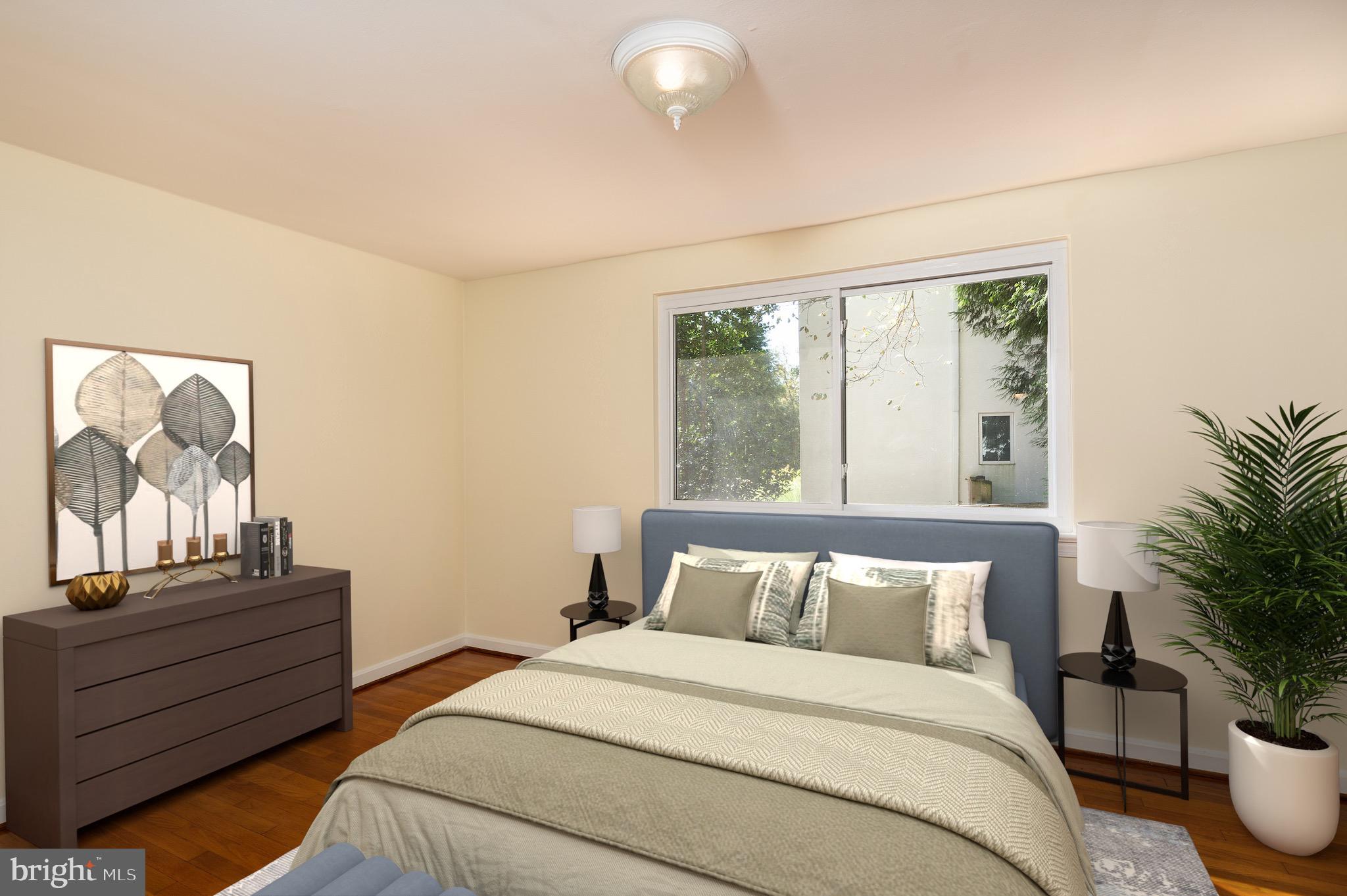 6221 Walhonding Road Bethesda, MD 20816 - Photo 26 of 51 a bedroom with bed and wooden floor
