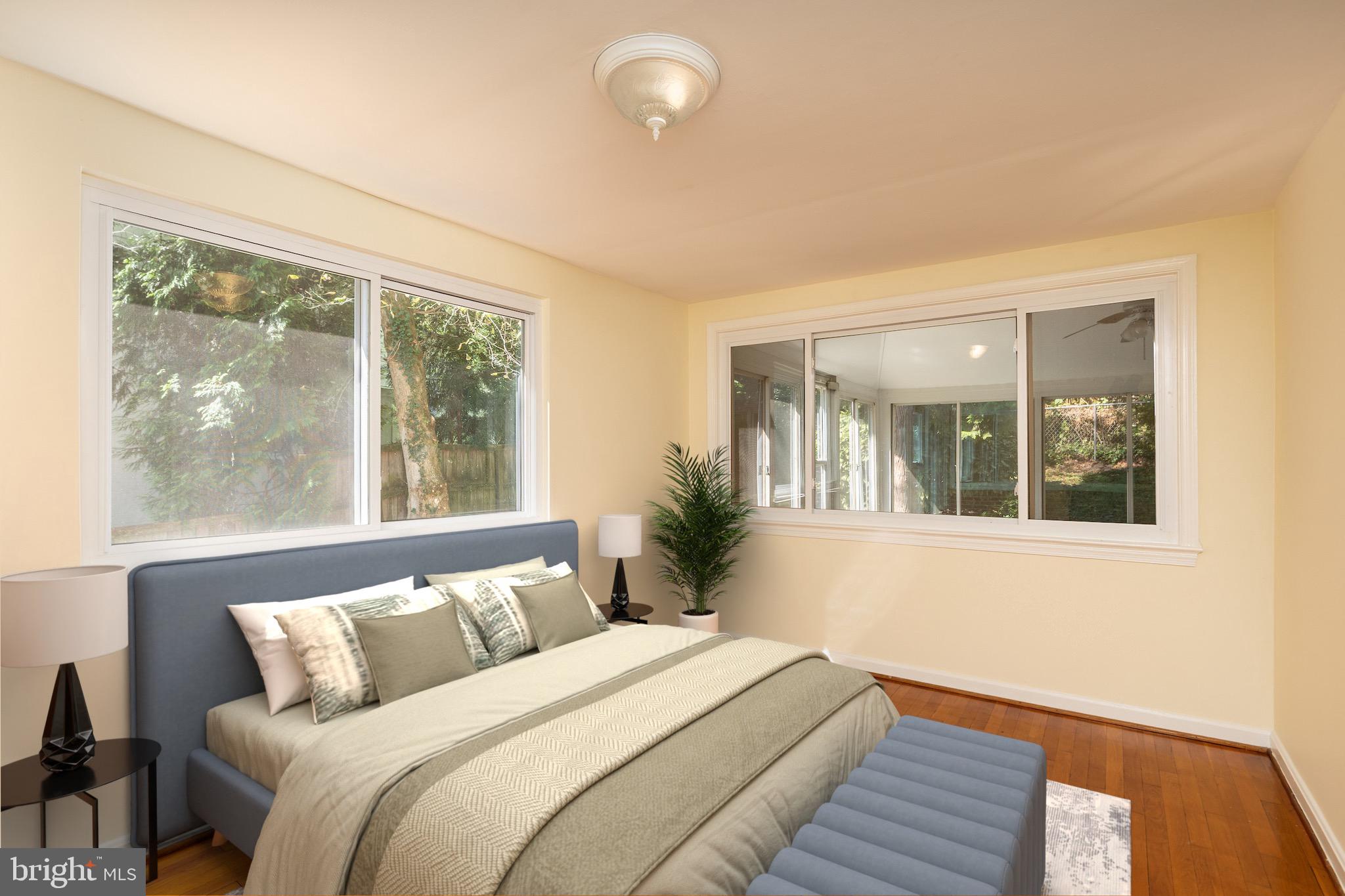 6221 Walhonding Road Bethesda, MD 20816 - Photo 28 of 51 a bed room with a bed and a large window