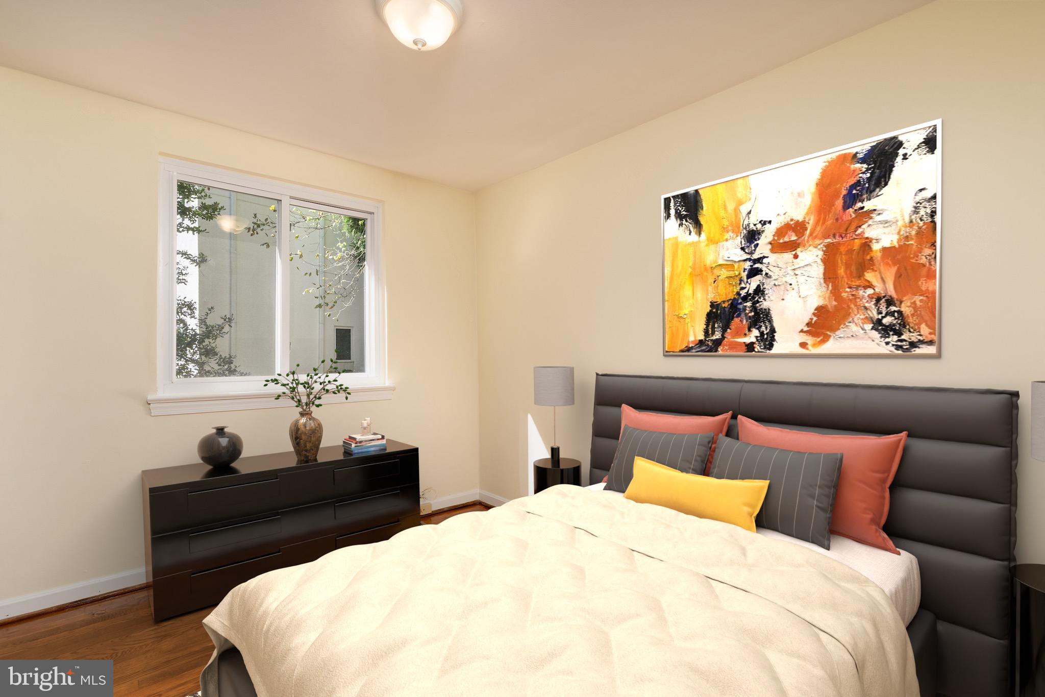 6221 Walhonding Road Bethesda, MD 20816 - Photo 30 of 51 a bedroom with a bed and wooden floor