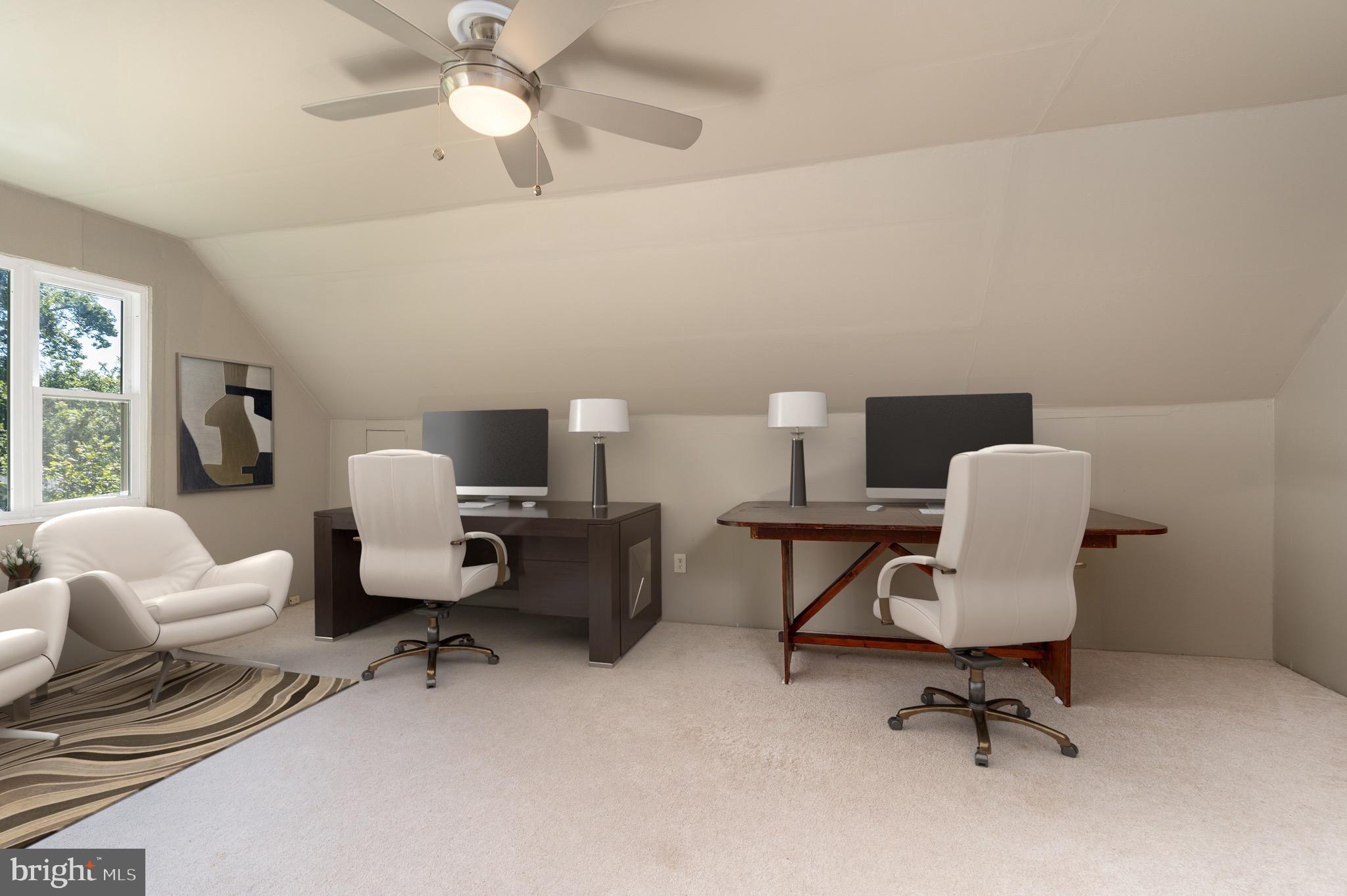 6221 Walhonding Road Bethesda, MD 20816 - Photo 39 of 51 a work room with furniture and a chandelier fan