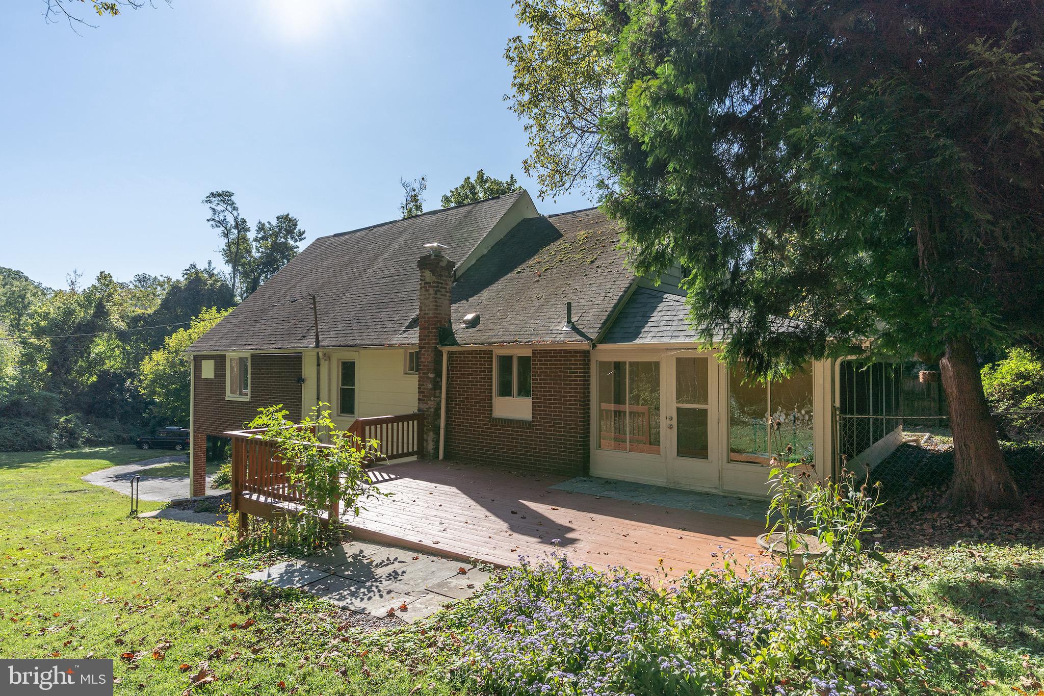 6221 Walhonding Road Bethesda, MD 20816 - Photo 45 of 51 front view of a house with a yard