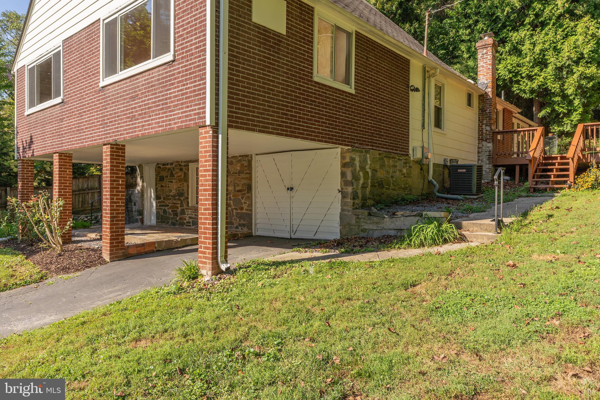 6221 Walhonding Road Bethesda, MD 20816 - Photo 47 of 51 a backyard of a house with yard and outdoor seating