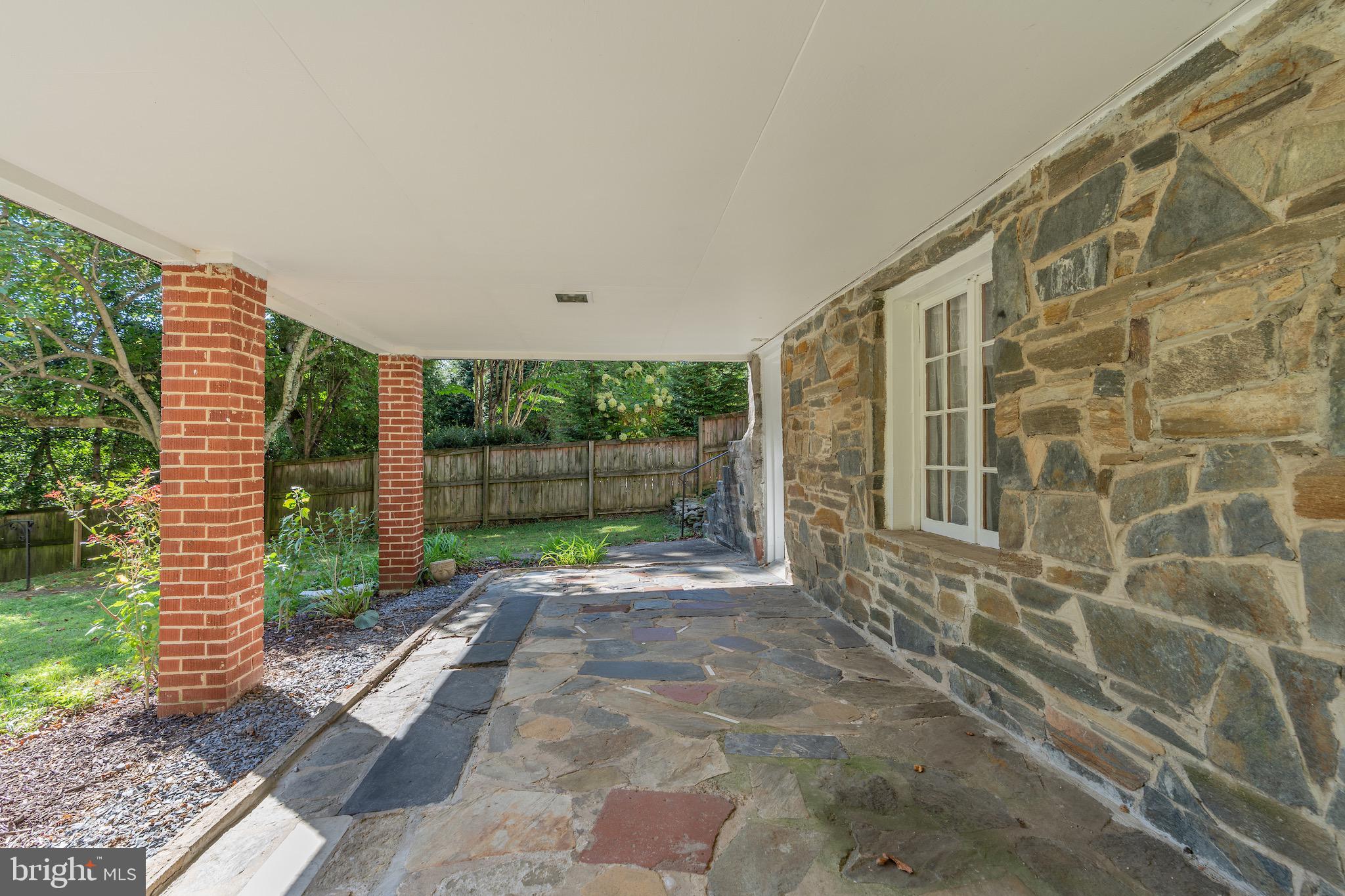 6221 Walhonding Road Bethesda, MD 20816 - Photo 48 of 51 a view of a garden from a patio