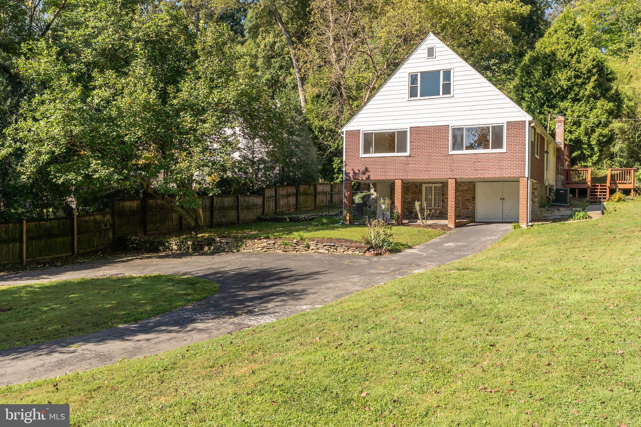 6221 Walhonding Road Bethesda, MD 20816 - Photo 51 of 51 a front view of a house with a yard