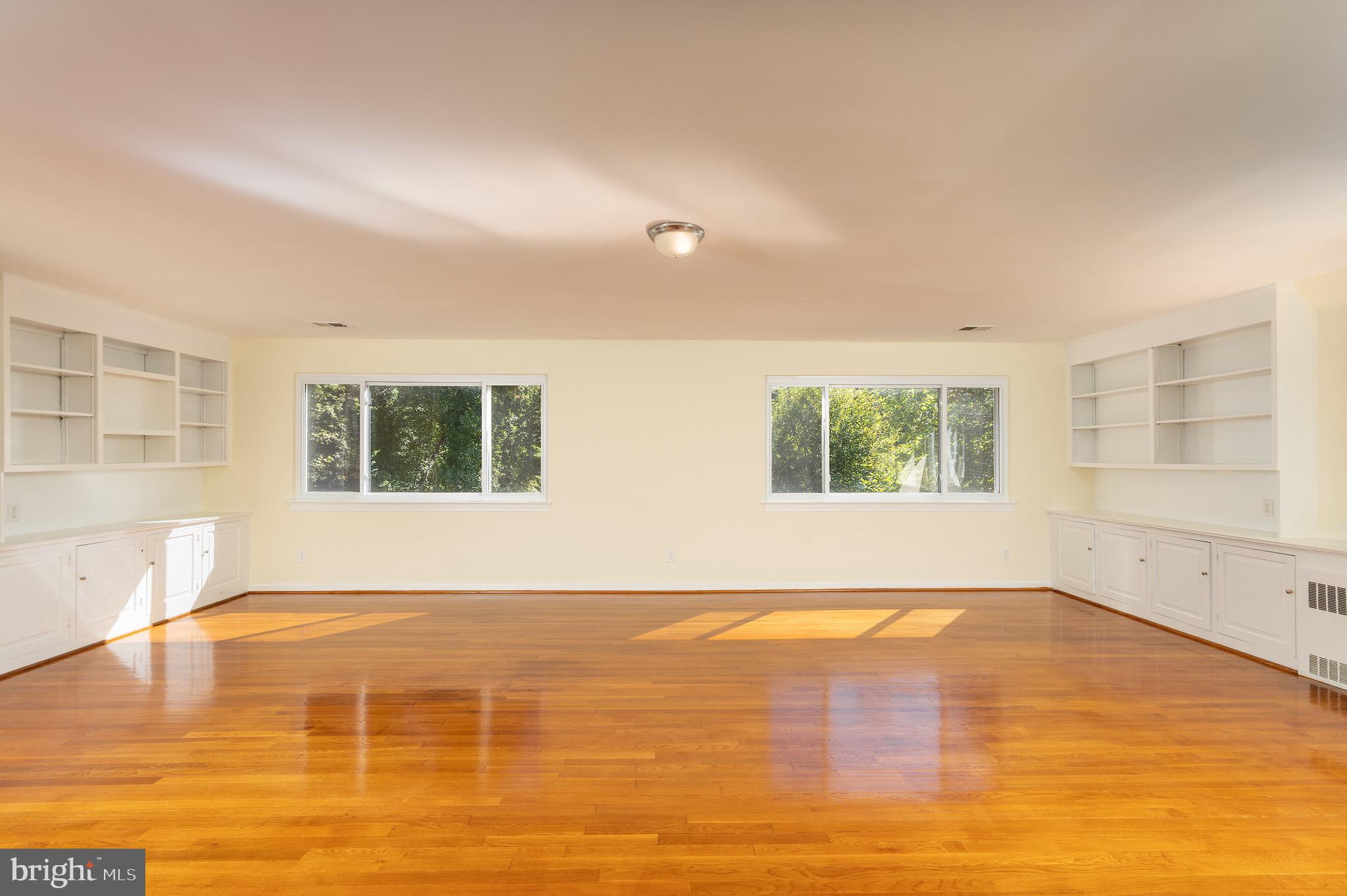6221 Walhonding Road Bethesda, MD 20816 - Photo 6 of 51 a view of an empty room with a window