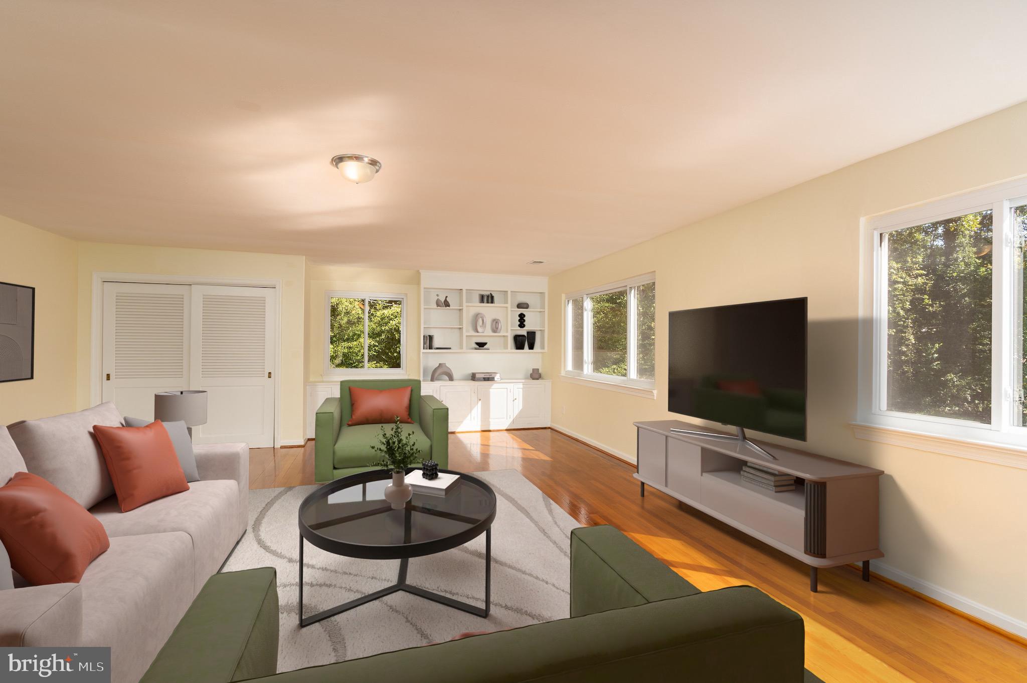 6221 Walhonding Road Bethesda, MD 20816 - Photo 7 of 51 a living room with furniture and a flat screen tv