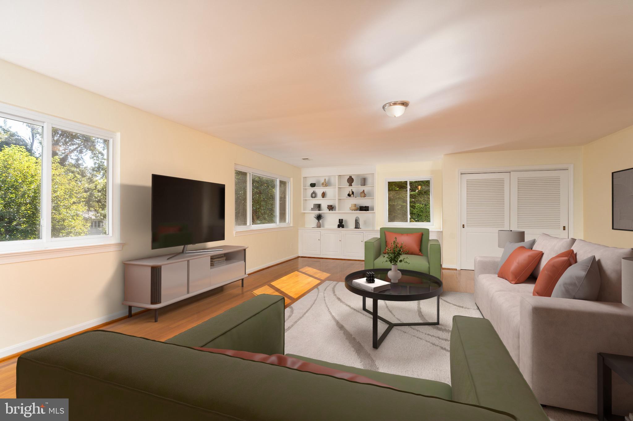 6221 Walhonding Road Bethesda, MD 20816 - Photo 9 of 51 a living room with furniture and a flat screen tv