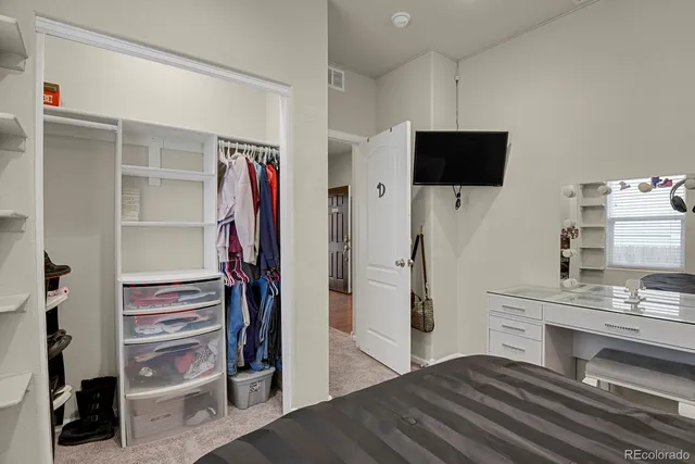 a bathroom with a granite countertop sink toilet and a mirror